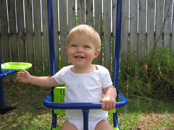 Sam on his new swing set